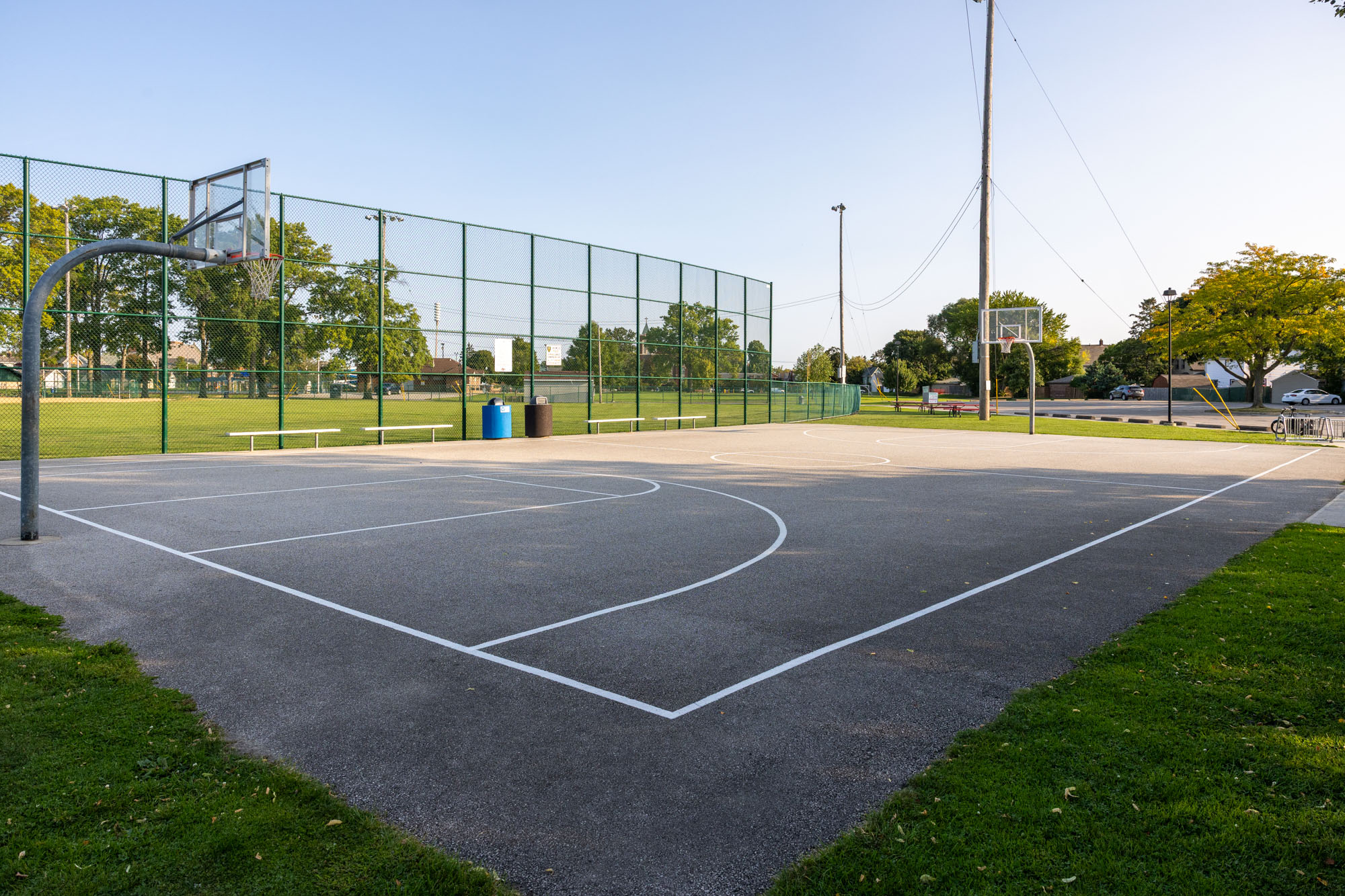Madison Park basketball court - full asphalt court with two hoops.