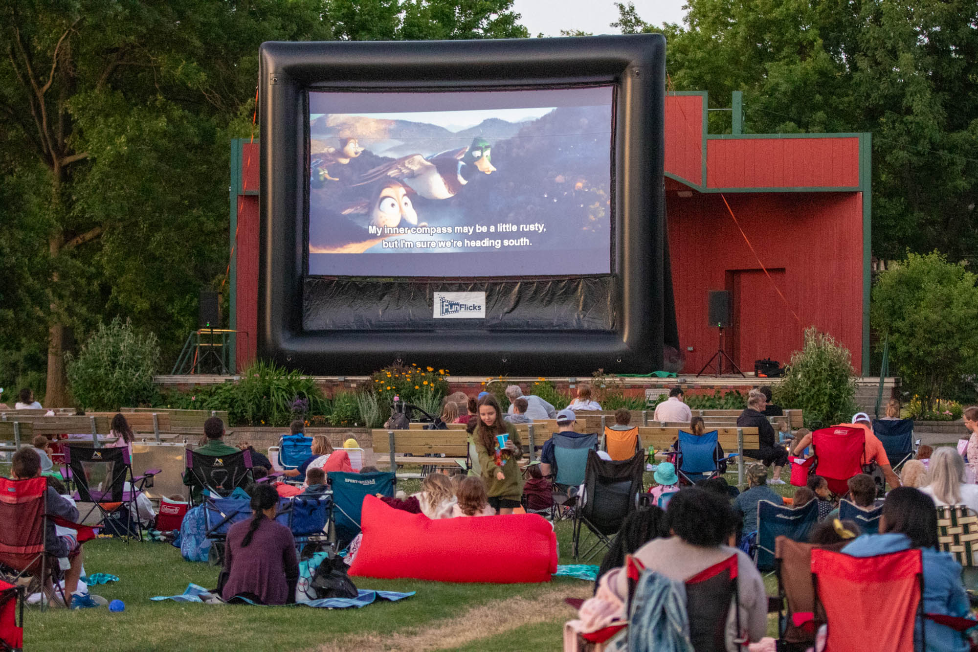 Families watch an outdoor movie at Lakewood Park.