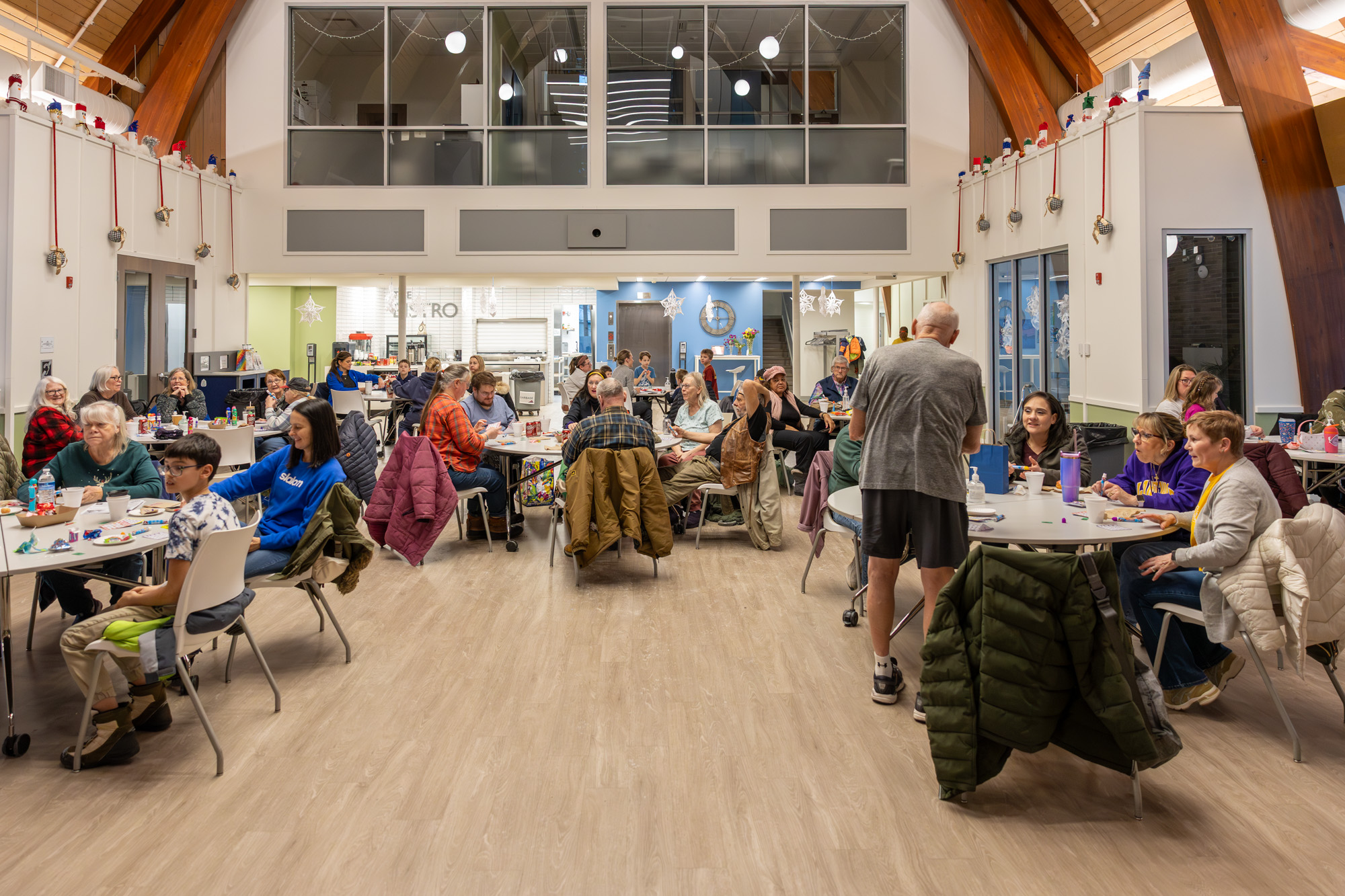 People of all ages gathered at tables during an event at Cove Community Center.